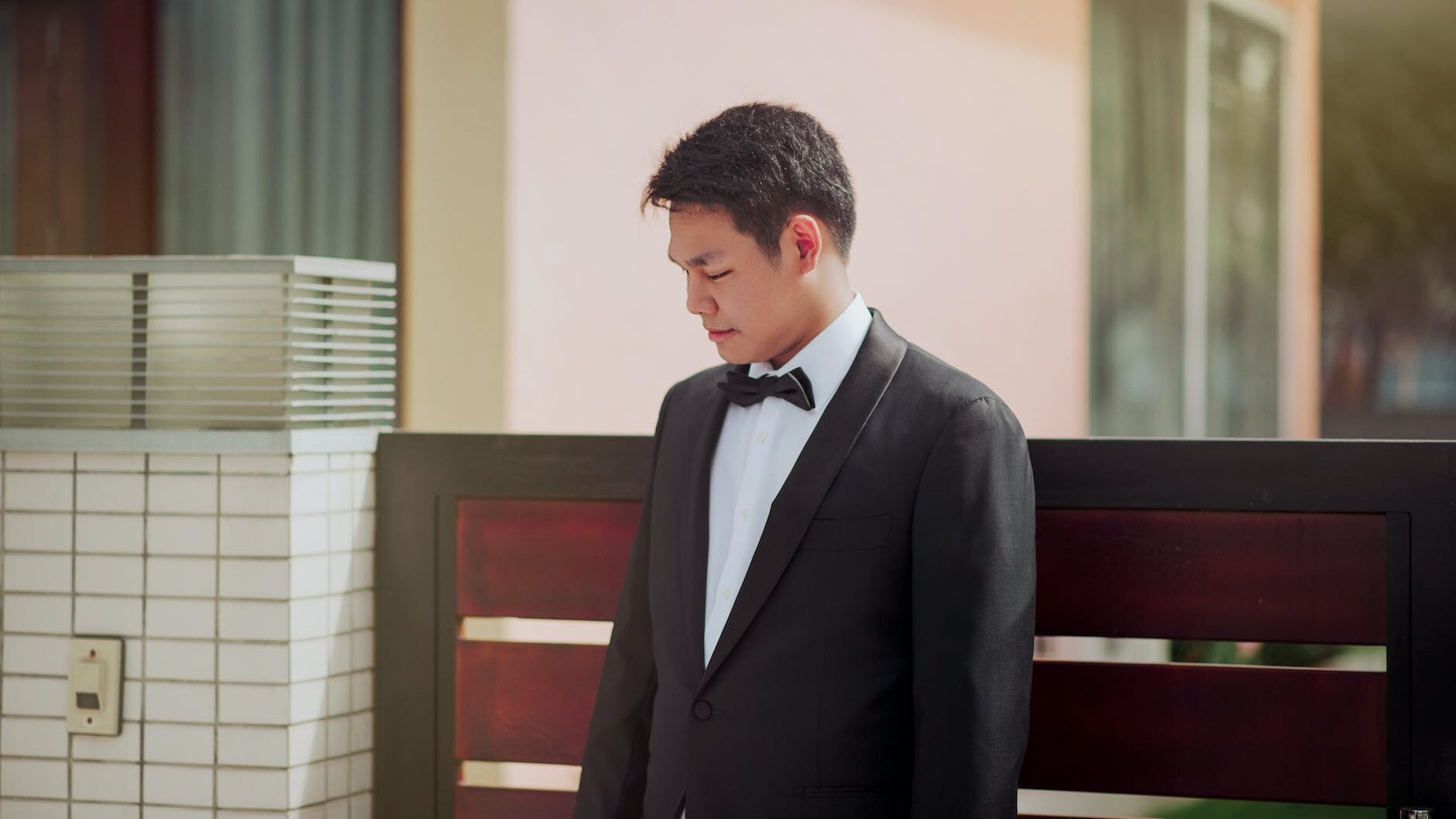 photo of the groom wearing his tuxedo