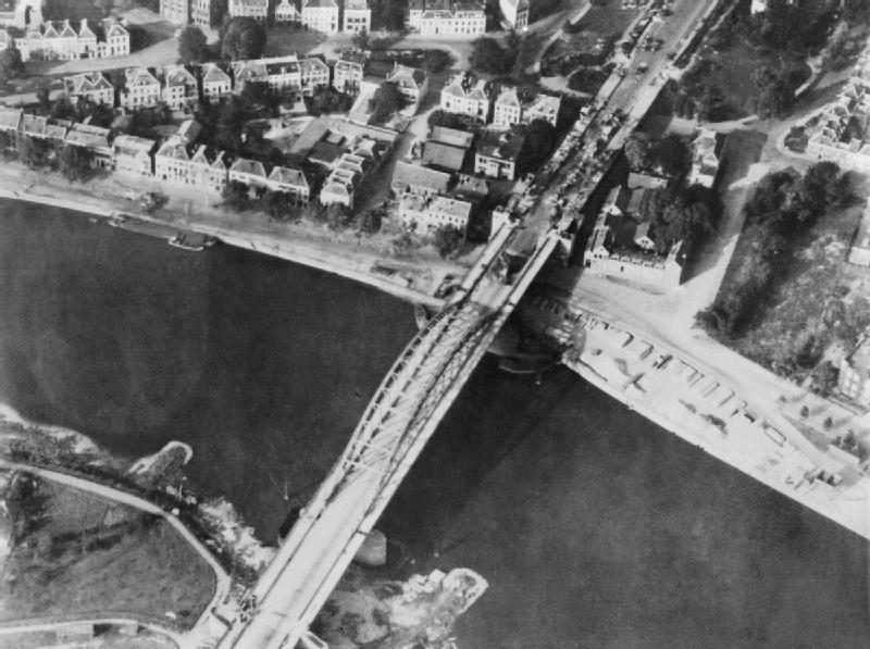 Aerial view of the bridge over the Neder Rijn, Arnhem; British troops and destroyed German armoured vehicles are visible at the north end of the bridge. Had General Montgomery's ambitious scheme for seizing the Rhine bridges succeeded, the war in Europe might have been shortened by many months. In the event, however, back-up forces were unable to come up quickly enough to enable the advanced airborne troops to hold the strategically vital bridge at Arnhem.